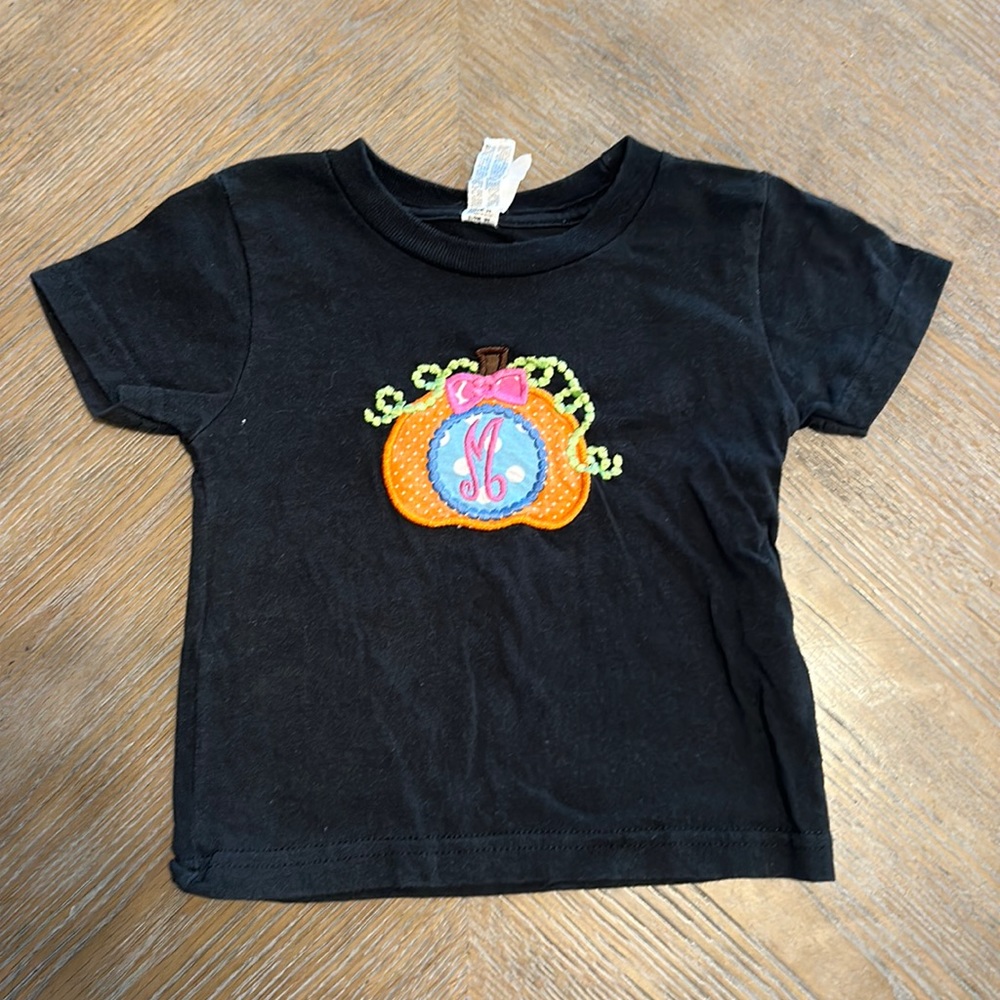 M embroidered pumpkin shirt